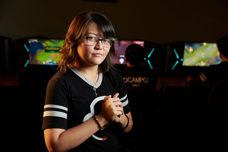 Portrait of woman in esports jersey