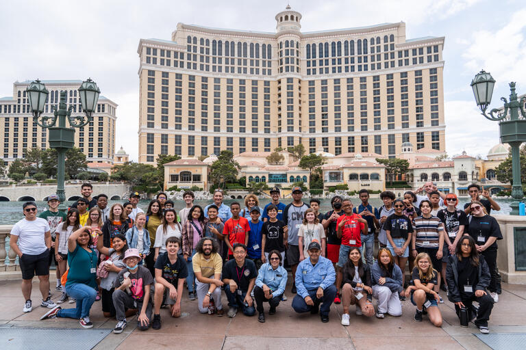 large group of young students in front of fountains of bellagio hotel