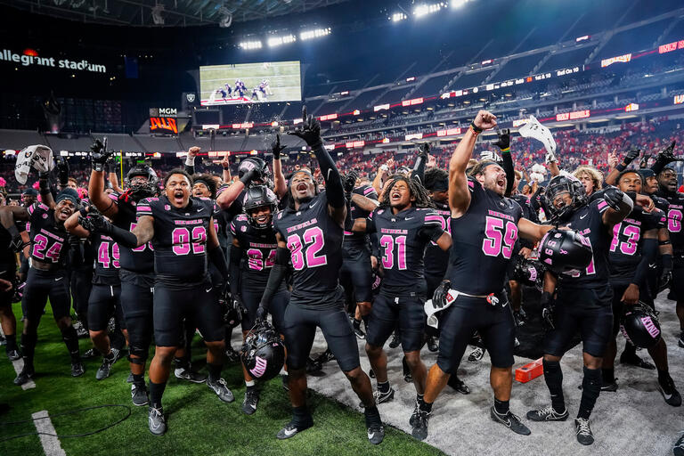 The UNLV Football team celebrates after a Homecoming win. (Lucas Peltier/UNLV Athletics)