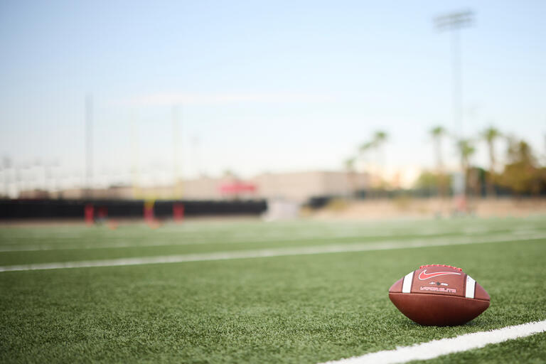 A football on a football field.