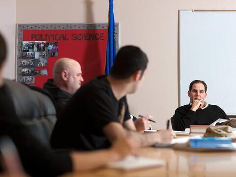 Political Science Students discussing political science during a graduate seminar.